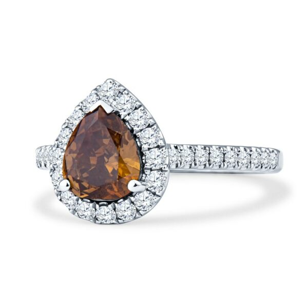 a pear shaped brown diamond ring with diamonds around it