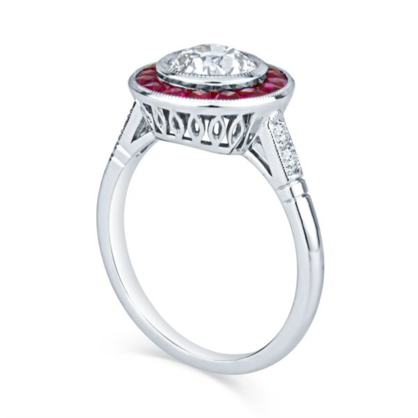 a diamond and ruby engagement ring on a white background