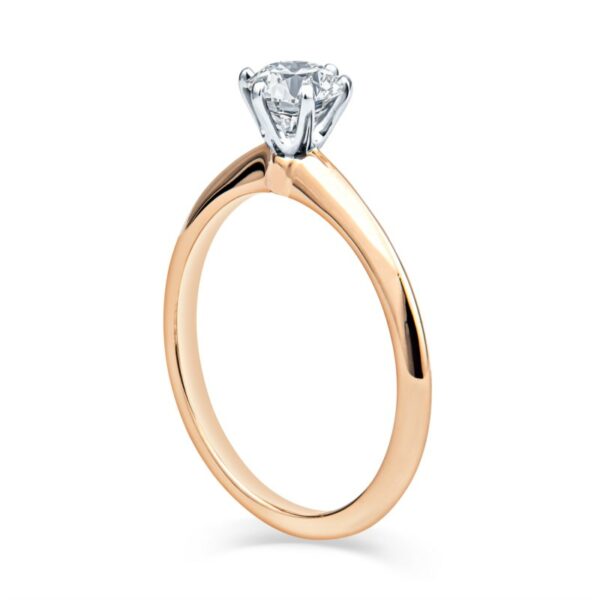 a rose gold engagement ring with a single diamond