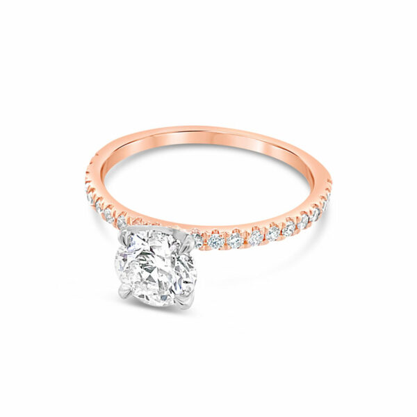 a rose gold ring with a single diamond