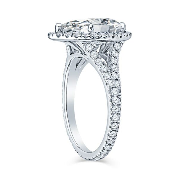 an oval shaped diamond engagement ring on a white background