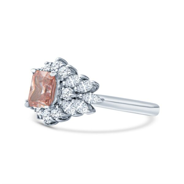 an orange diamond ring with diamonds around it