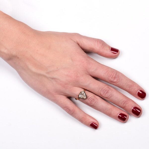 a woman's hand with a ring on it