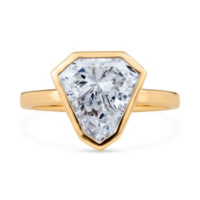 a yellow gold ring with an octagonal cut diamond