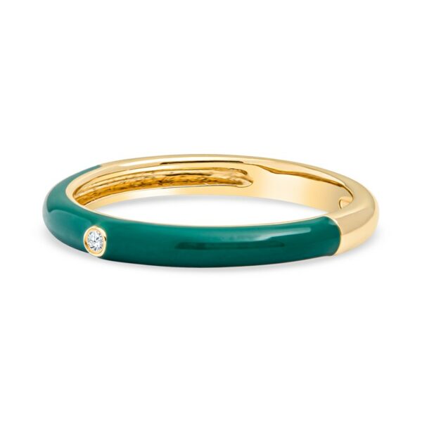 a gold and green ring with a diamond