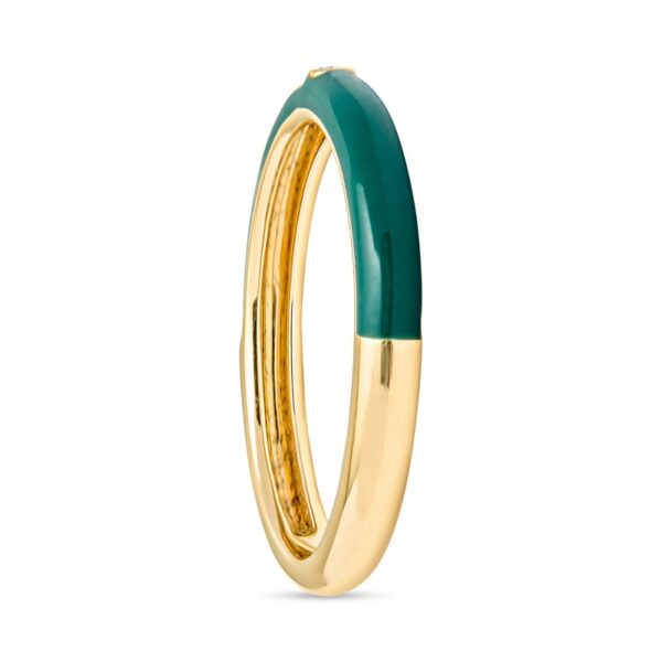 a gold ring with green enamel in the middle