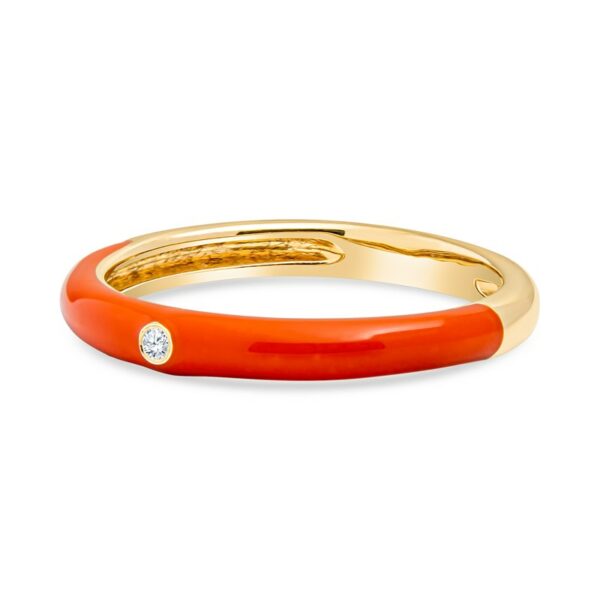 an orange ring with a diamond in the middle