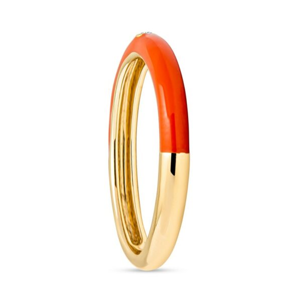 an orange and gold ring on a white background