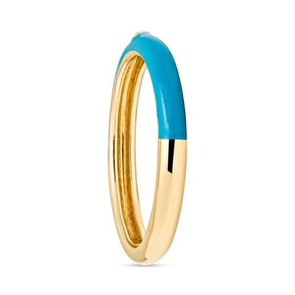 a gold ring with blue enamel in the middle