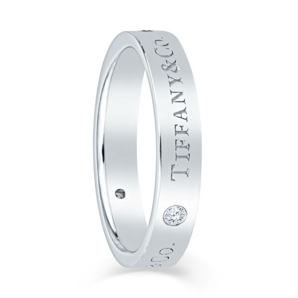 a white gold wedding ring with the words, love and affection engraved on it