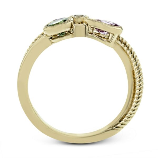 a yellow gold ring with three stone accents