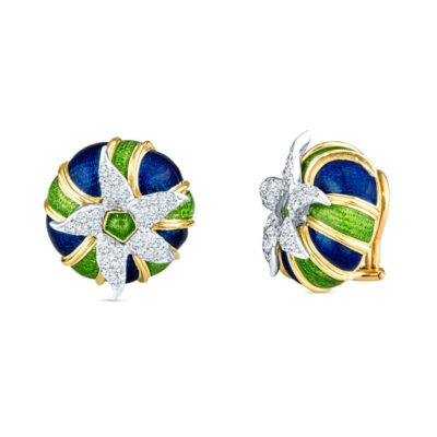 a pair of earrings with green and blue enamel