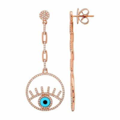 a pair of earrings with an evil eye