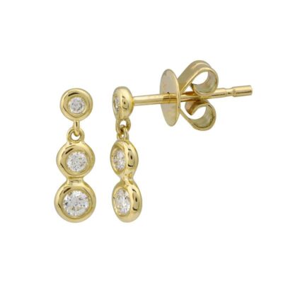 a pair of diamond earrings in yellow gold