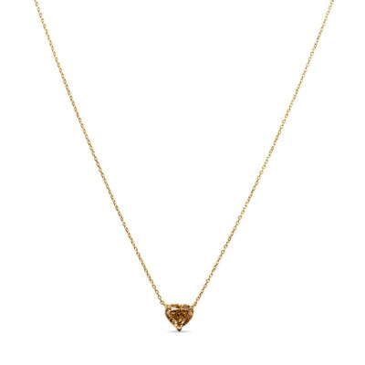 a gold heart necklace on a white background