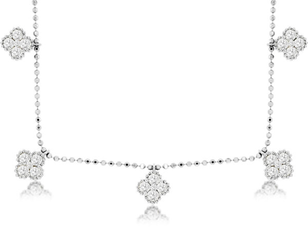 a necklace with four diamonds on it