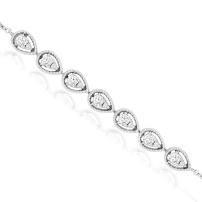 a white gold bracelet with pear shaped diamonds
