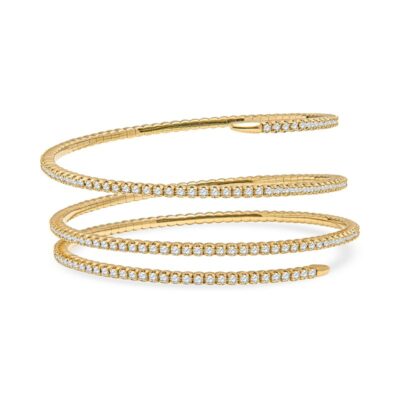 a gold bracelet with white stones