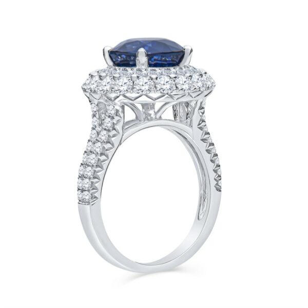 a blue and white diamond ring with two rows of diamonds around it