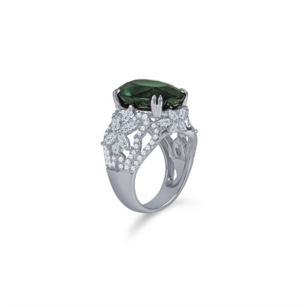 a ring with a green stone surrounded by white diamonds