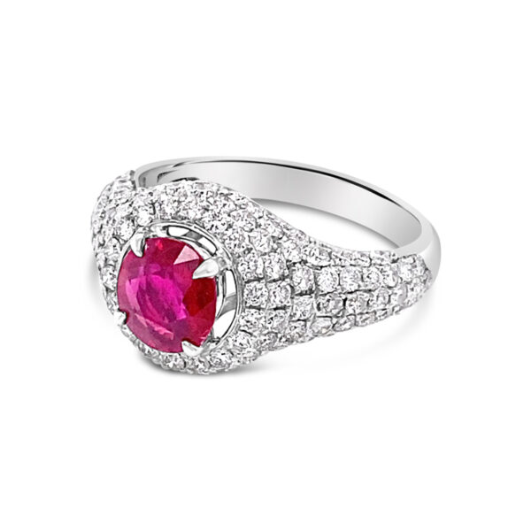 a ring with a pink stone surrounded by diamonds