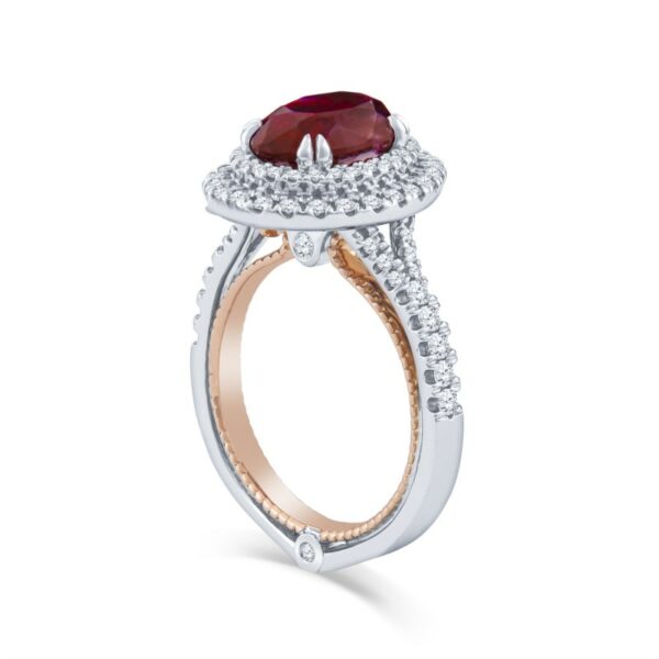 a ring with a large red stone surrounded by diamonds