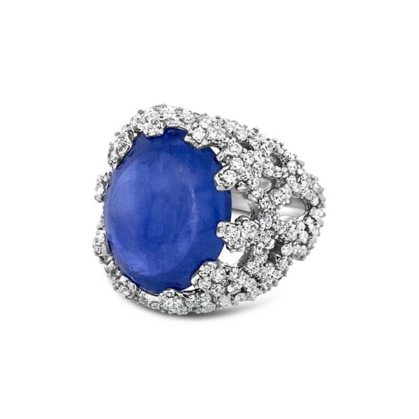 an oval shaped blue stone surrounded by white diamonds
