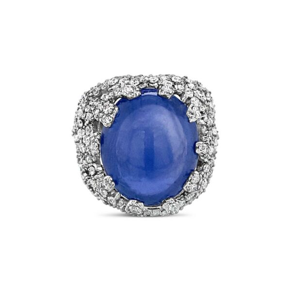 an oval blue stone surrounded by white diamonds