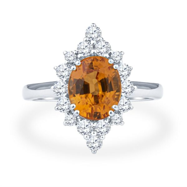 a ring with an orange stone surrounded by white diamonds