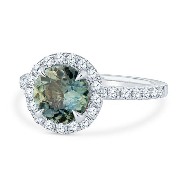 a ring with a green diamond surrounded by diamonds