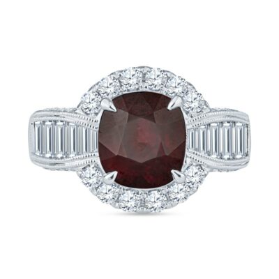 a ring with a red stone surrounded by white diamonds