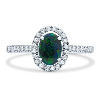 an oval shaped black opal surrounded by white diamonds