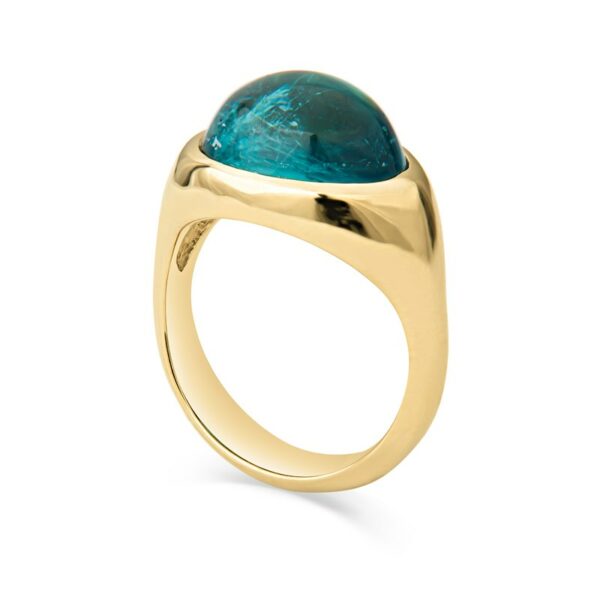 a gold ring with a large blue stone