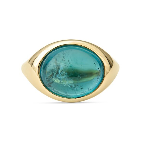 a gold ring with an oval blue stone