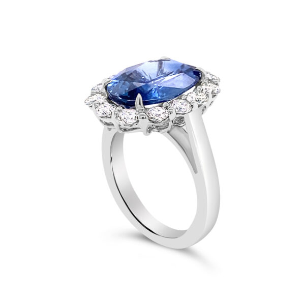 a ring with a blue sapphire and diamonds