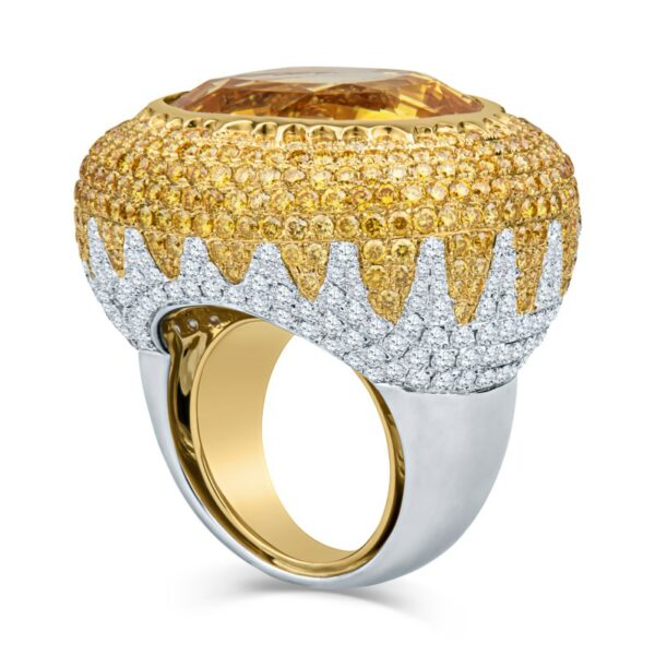 a ring with yellow and white diamonds on it