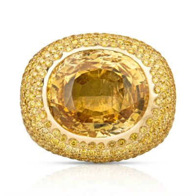 a large yellow diamond ring set in 18k gold