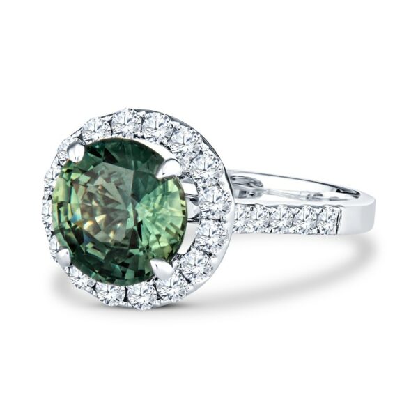 a ring with a green diamond surrounded by white diamonds