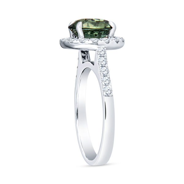a ring with a green stone and diamonds on it
