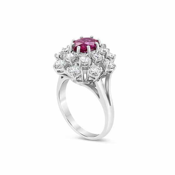 a pink and white diamond ring on a white background