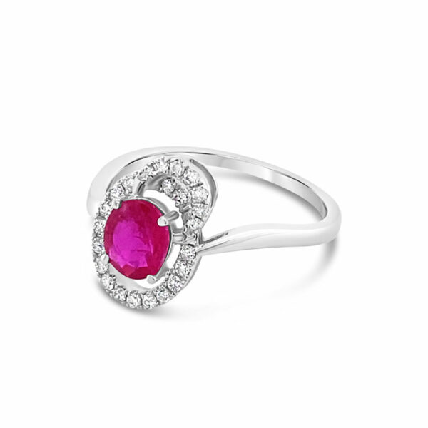 a white gold ring with an oval ruby stone and diamonds