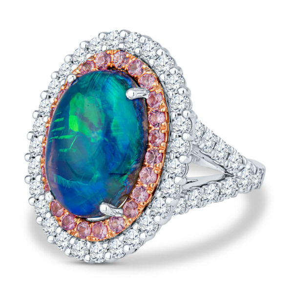 a ring with an oval blue opal surrounded by pink and white diamonds
