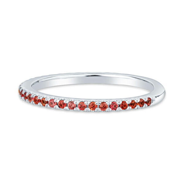 a white gold band with red stones