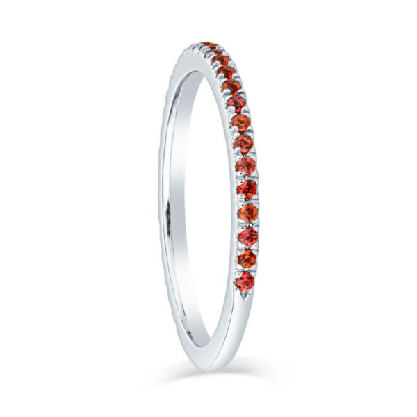 a white gold ring with red stones