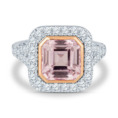 a pink diamond ring with diamonds surrounding it