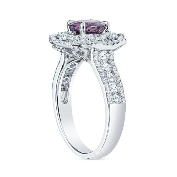 a white gold ring with a pink diamond center
