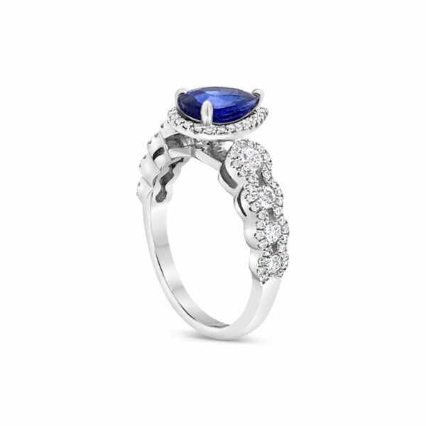 a ring with a blue stone and white diamonds