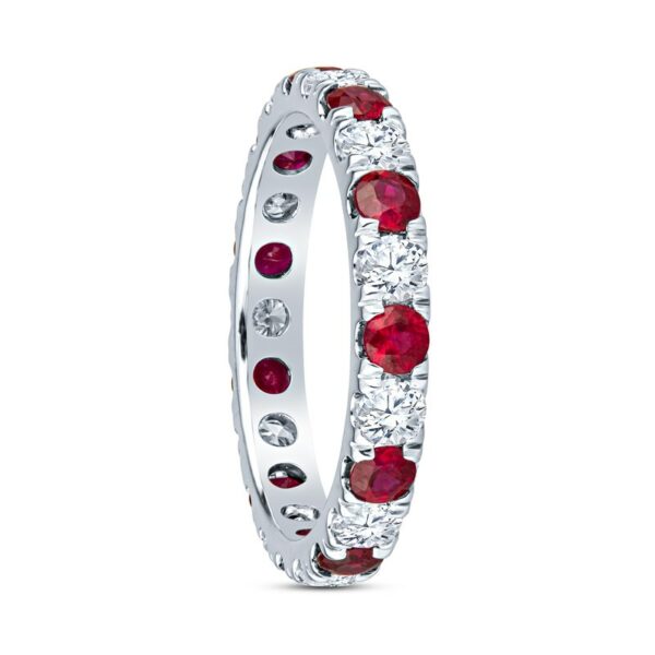a white gold ring with red and white stones