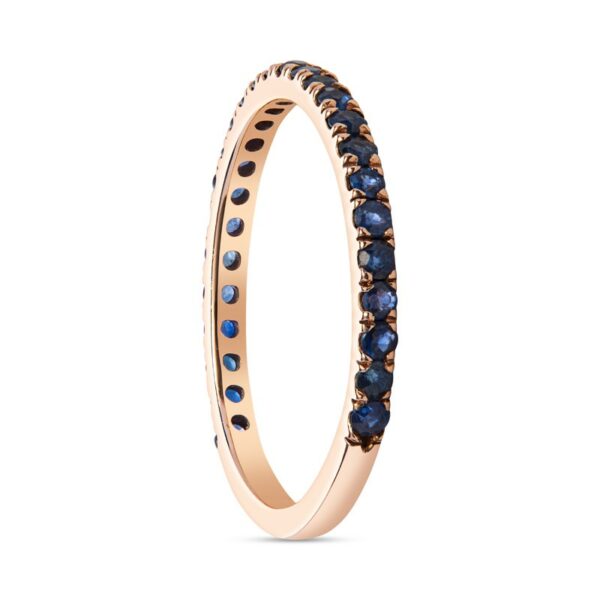 a rose gold ring with blue sapphire stones