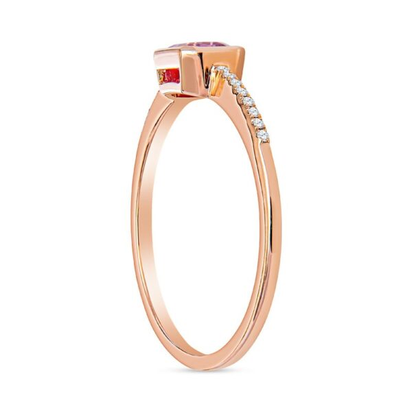 a rose gold ring with two stones on the side